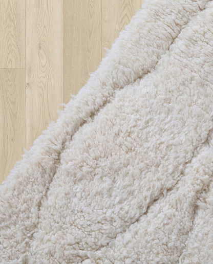 AYA Beni Ourain cream carved linear grid Moroccan rug close-up showing hand-knotted wool texture and pile detail 1, by NURA