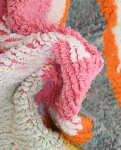 BASIMA Azilal mustard organic abstract Moroccan rug close-up showing hand-knotted wool texture and pile detail, by NURA