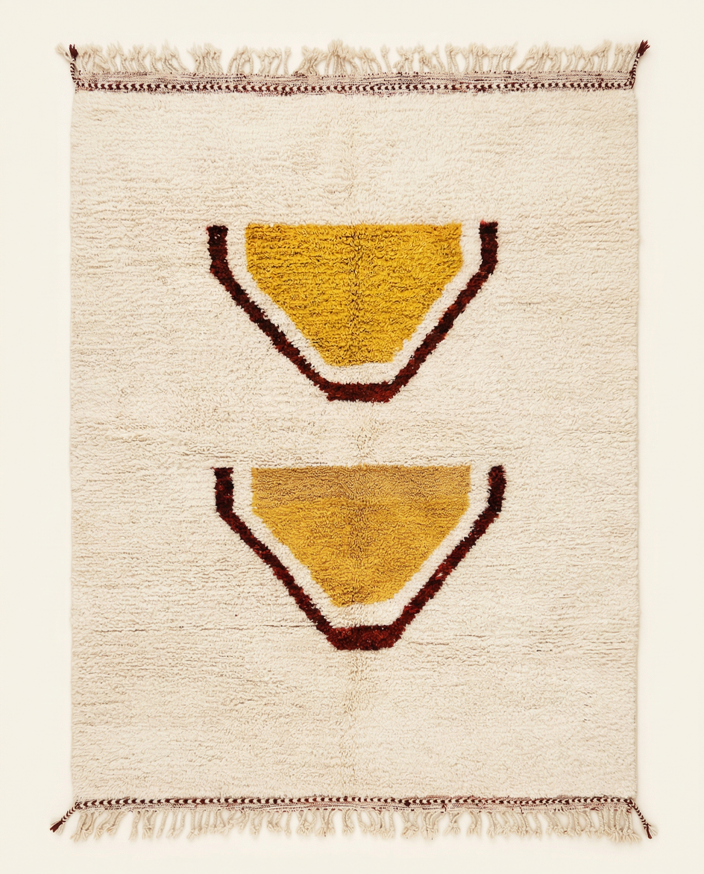 Plush cream Beni Ourain Moroccan rug with large stacked abstract motifs in mustard yellow and rust, by NURA.