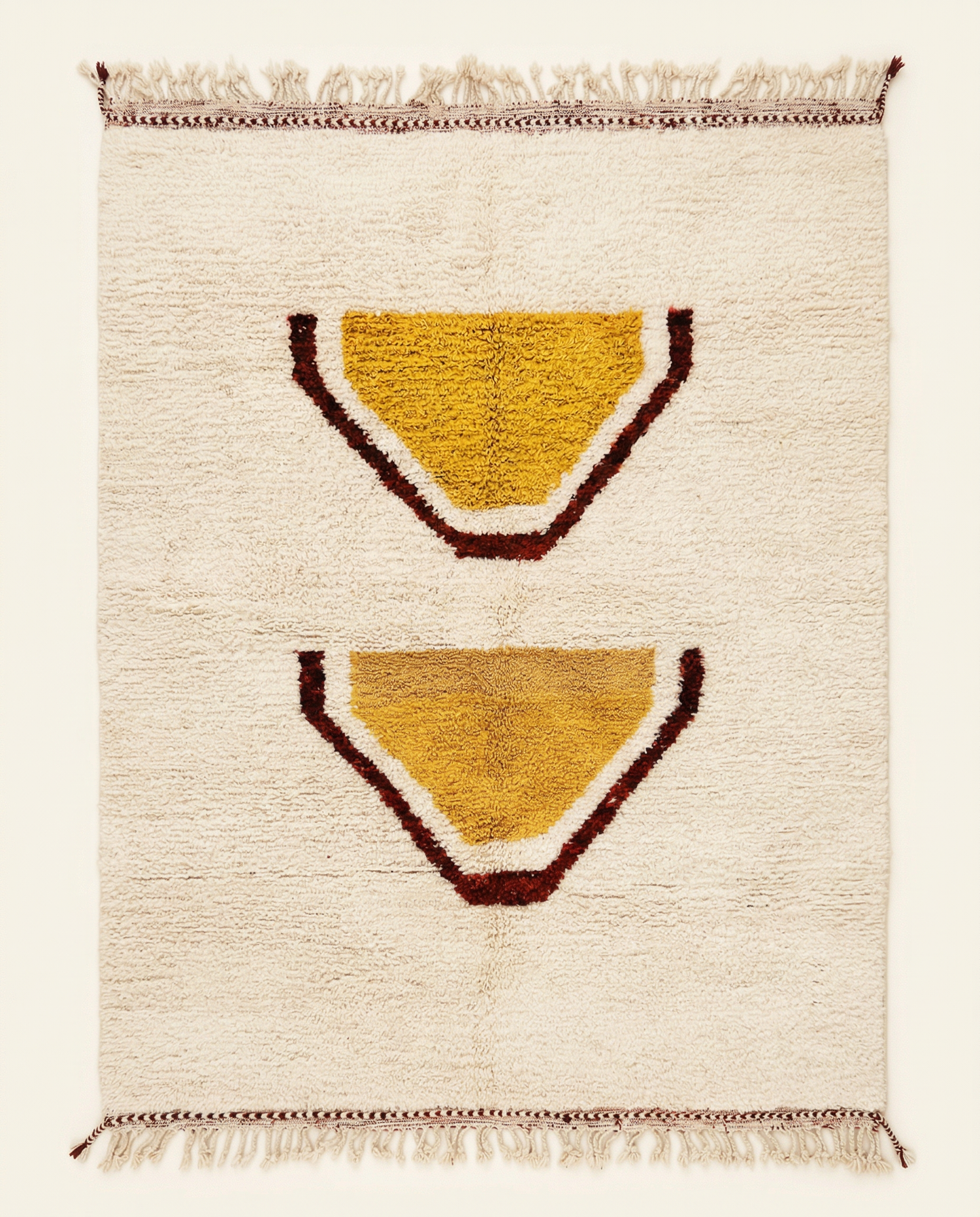 Plush cream Beni Ourain Moroccan rug with large stacked abstract motifs in mustard yellow and rust, by NURA.