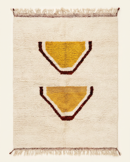 Plush cream Beni Ourain Moroccan rug with large stacked abstract motifs in mustard yellow and rust, by NURA.