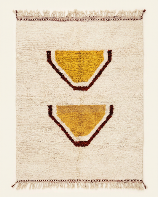 Plush cream Beni Ourain Moroccan rug with large stacked abstract motifs in mustard yellow and rust, by NURA.