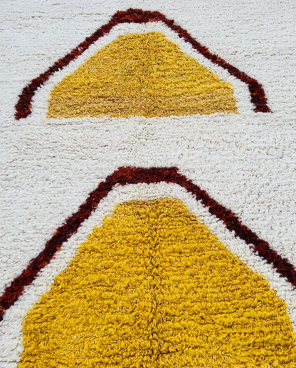 BASMA Beni Ourain cream stacked abstract motifs Moroccan rug close-up showing hand-knotted wool texture and pile detail 1, by NURA