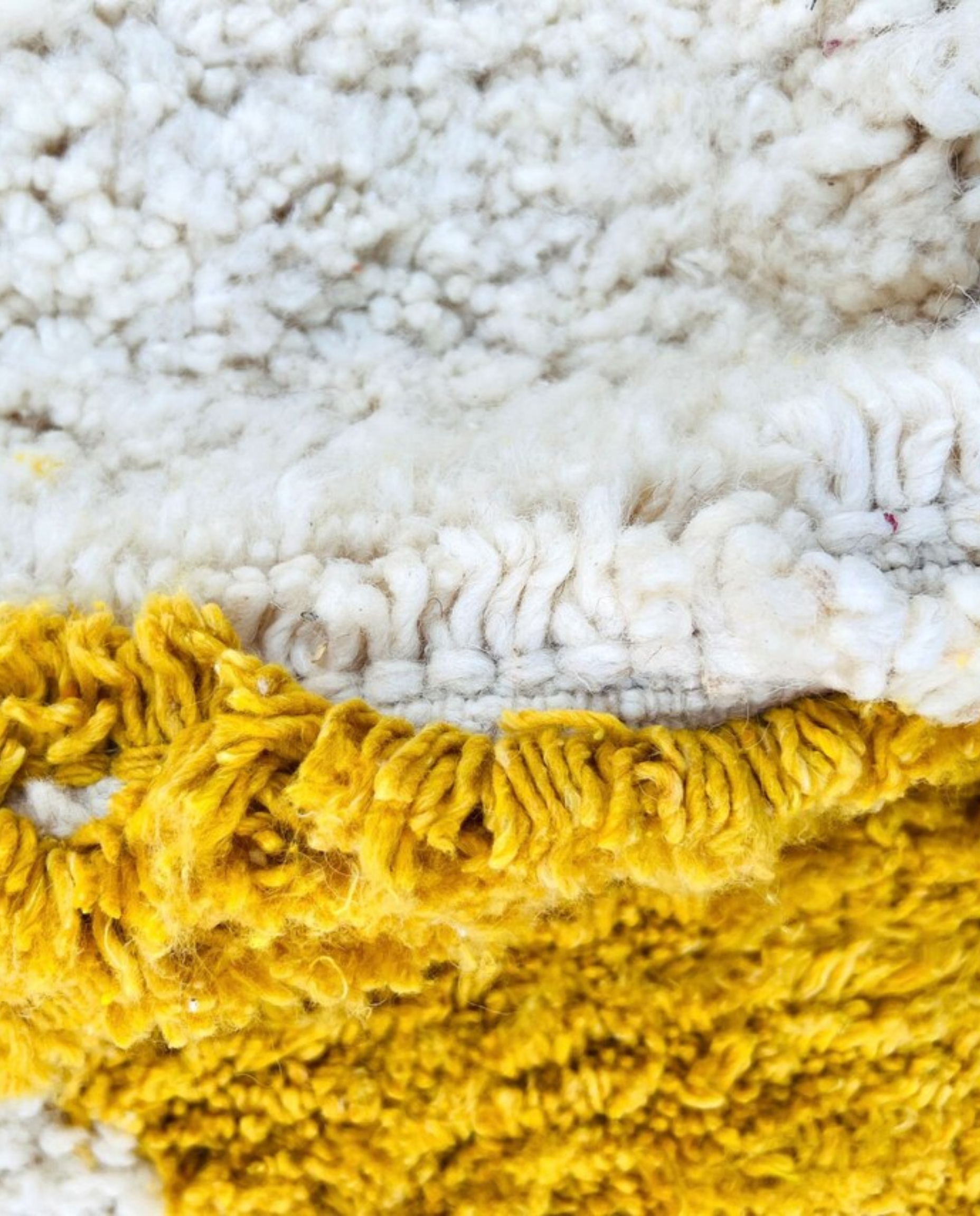 BASMA Beni Ourain cream stacked abstract motifs Moroccan rug close-up showing hand-knotted wool texture and pile detail 2, by NURA