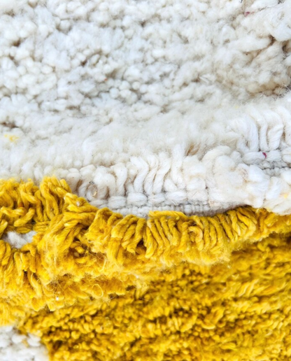 BASMA Beni Ourain cream stacked abstract motifs Moroccan rug close-up showing hand-knotted wool texture and pile detail 2, by NURA