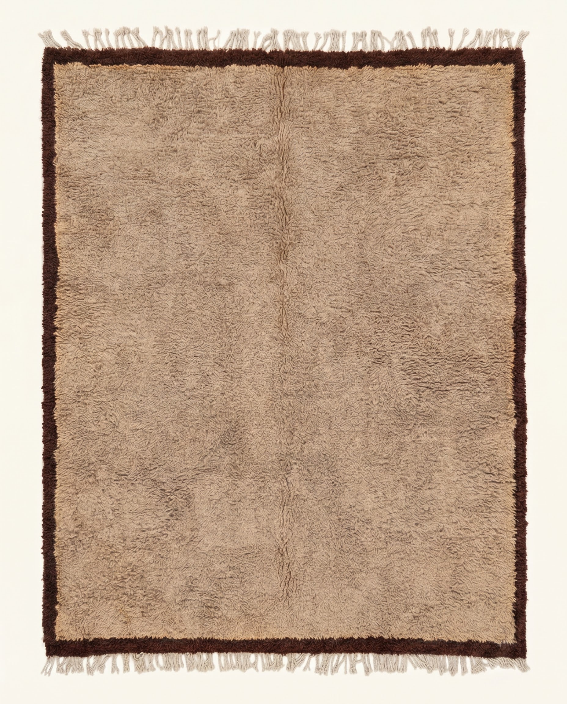 Plush tan Beni Ourain Moroccan rug featuring a thick chocolate brown border, hand-knotted from virgin wool by NURA.