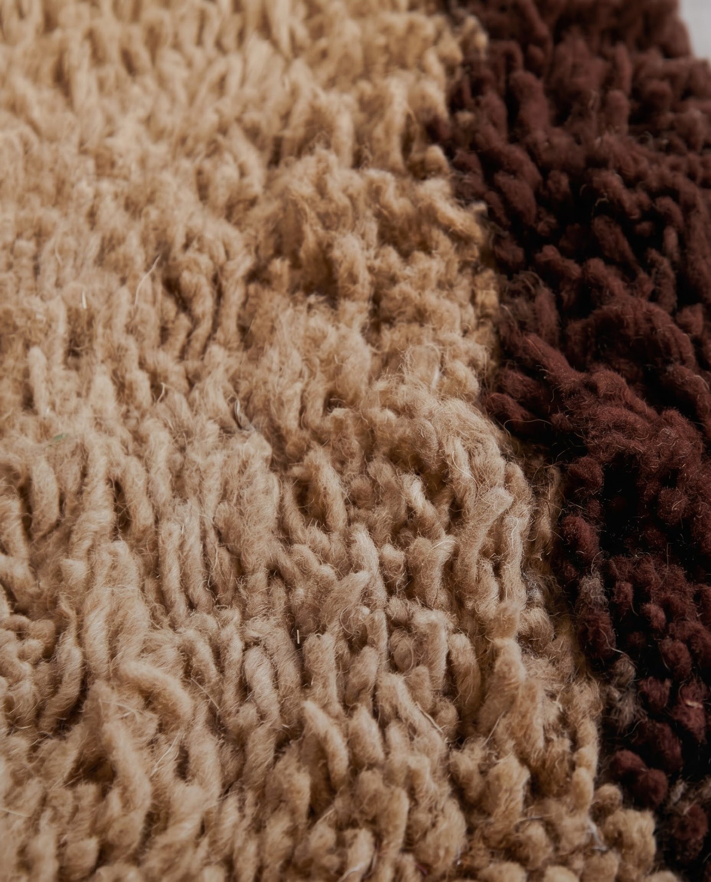 BAYA Beni Ourain tan bordered field Moroccan rug close-up showing hand-knotted wool texture and pile detail, by NURA