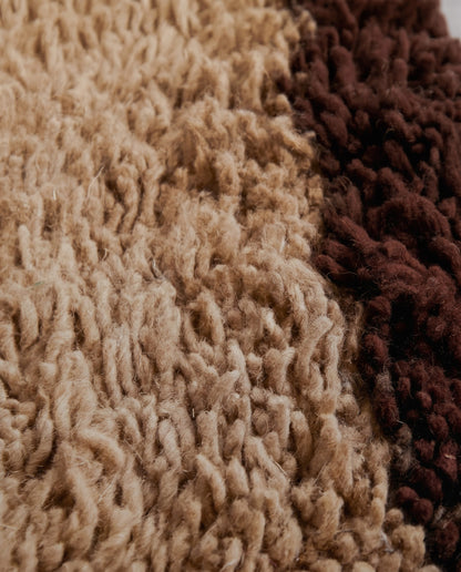 BAYA Beni Ourain tan bordered field Moroccan rug close-up showing hand-knotted wool texture and pile detail, by NURA