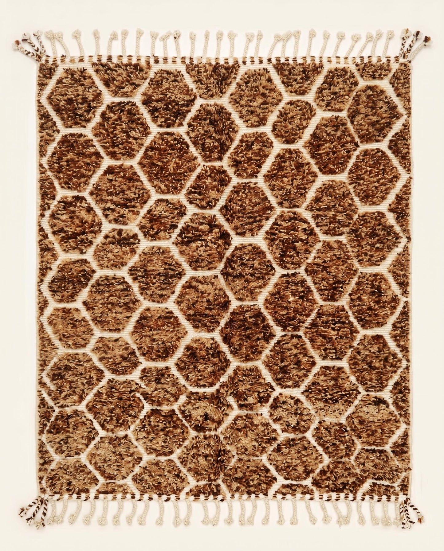 Plush brown and cream Azilal Moroccan rug featuring a raised geometric honeycomb lattice pattern, handcrafted by NURA.