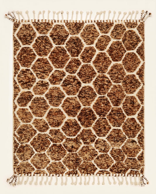 Plush brown and cream Azilal Moroccan rug featuring a raised geometric honeycomb lattice pattern, handcrafted by NURA.