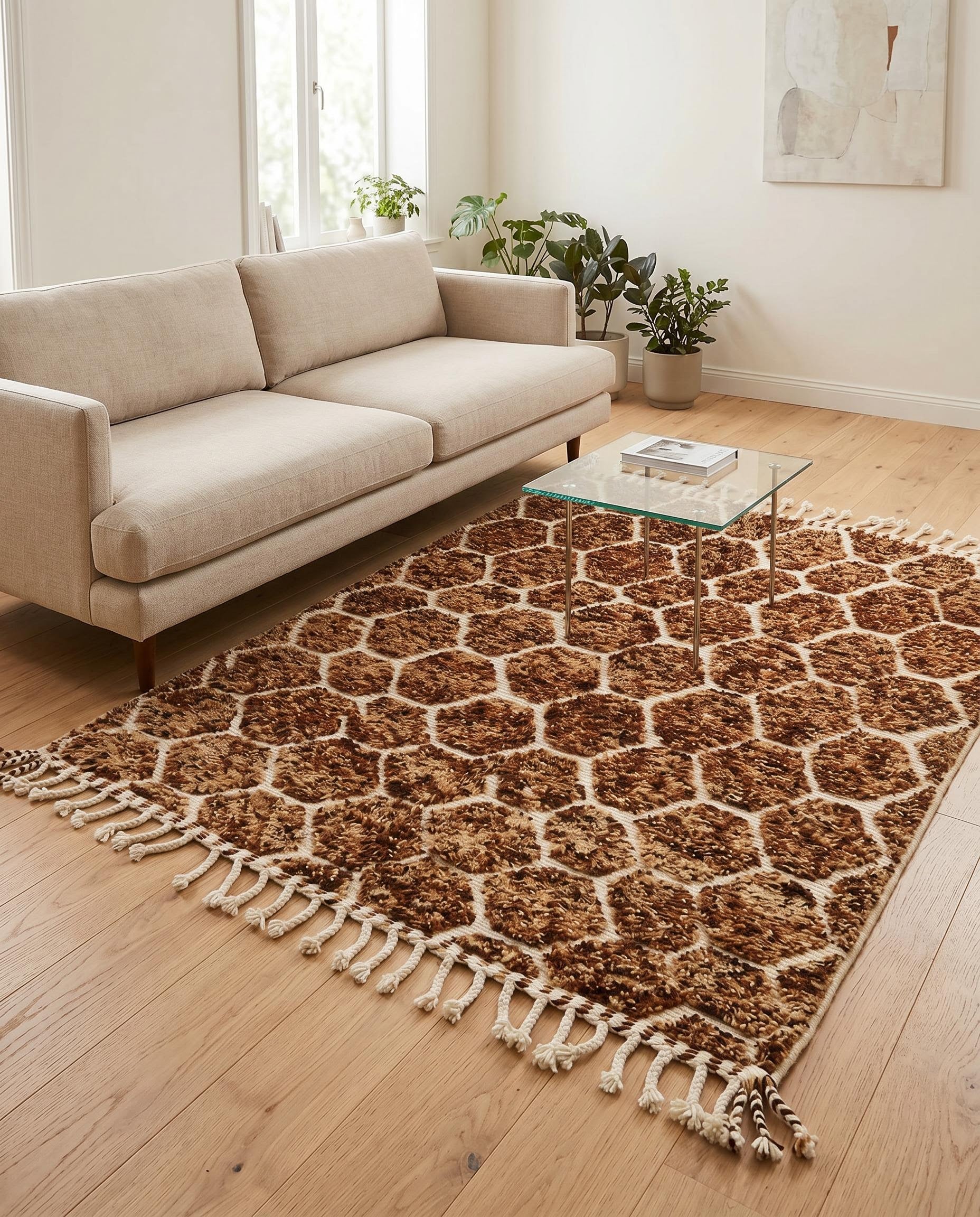 Plush brown and cream geometric Moroccan rug styled in a warm, modern living room with natural wood furniture, by NURA.