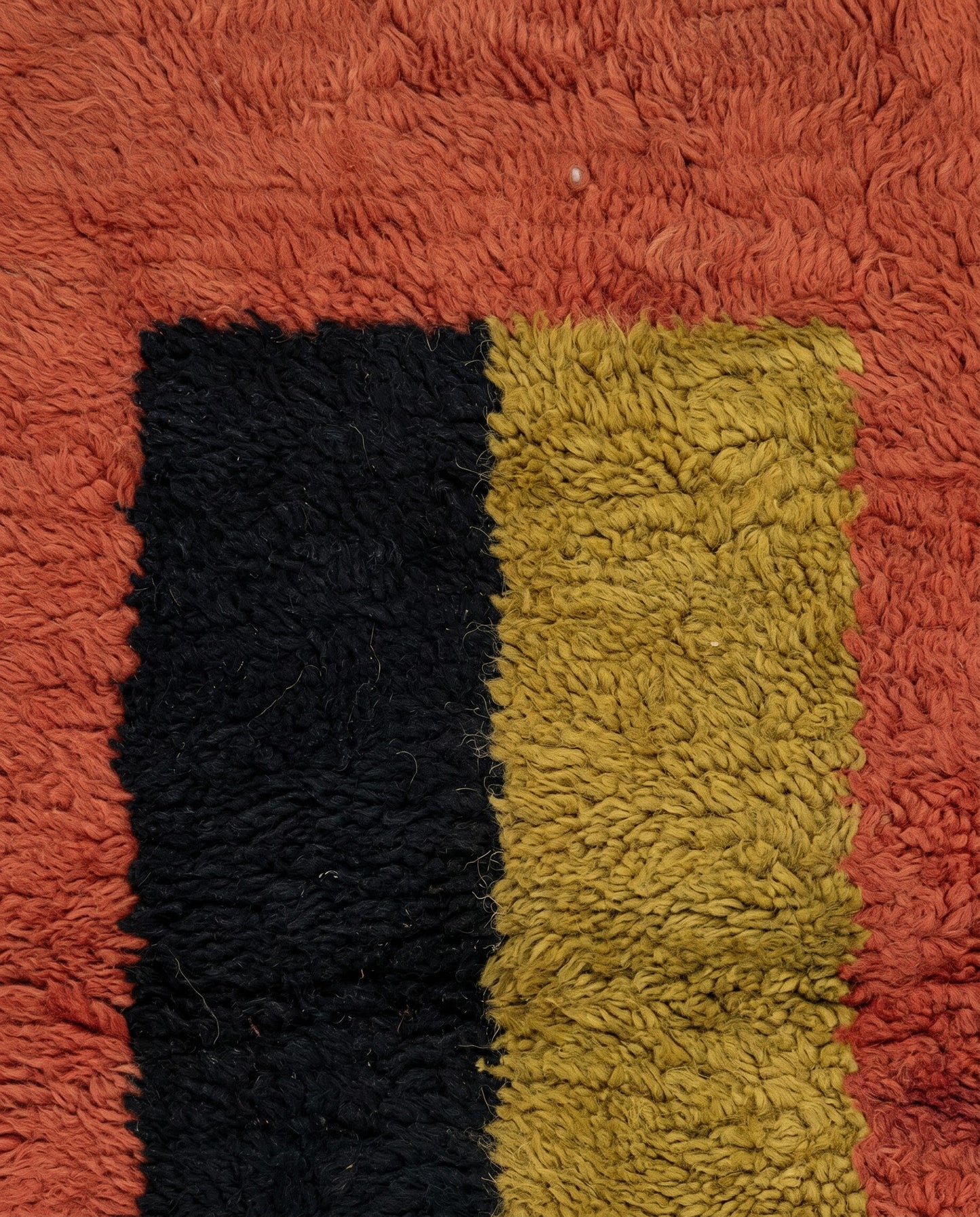 BILSAN Beni Ourain terracotta color block grid Moroccan rug close-up showing hand-knotted wool texture and pile detail, by NURA