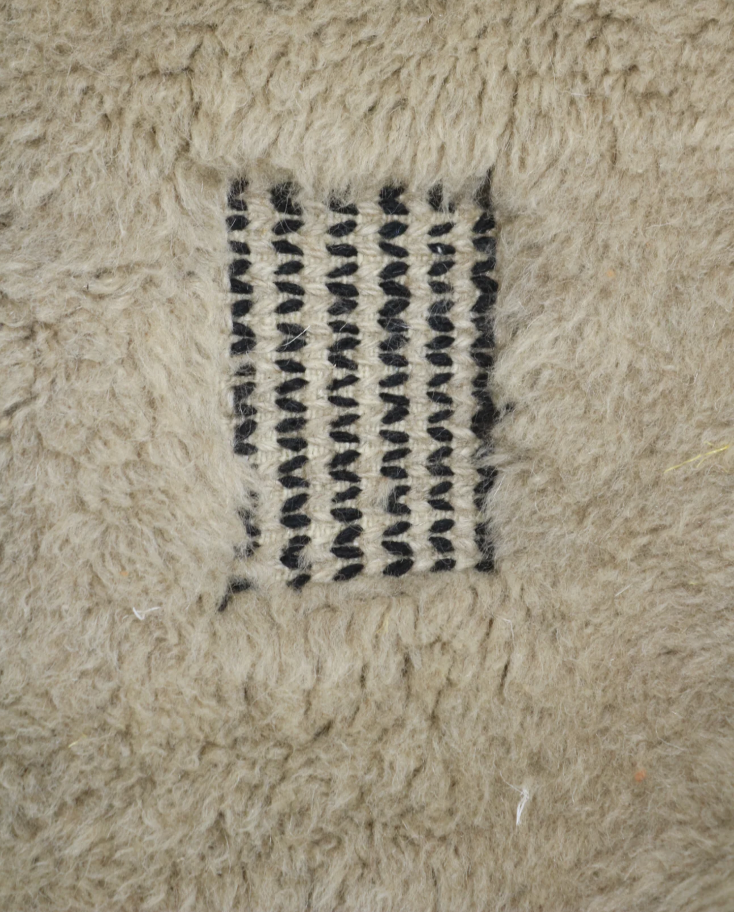 BINA Mrirt cream diamond lattice Moroccan rug close-up showing hand-knotted wool texture and pile detail 2, by NURA