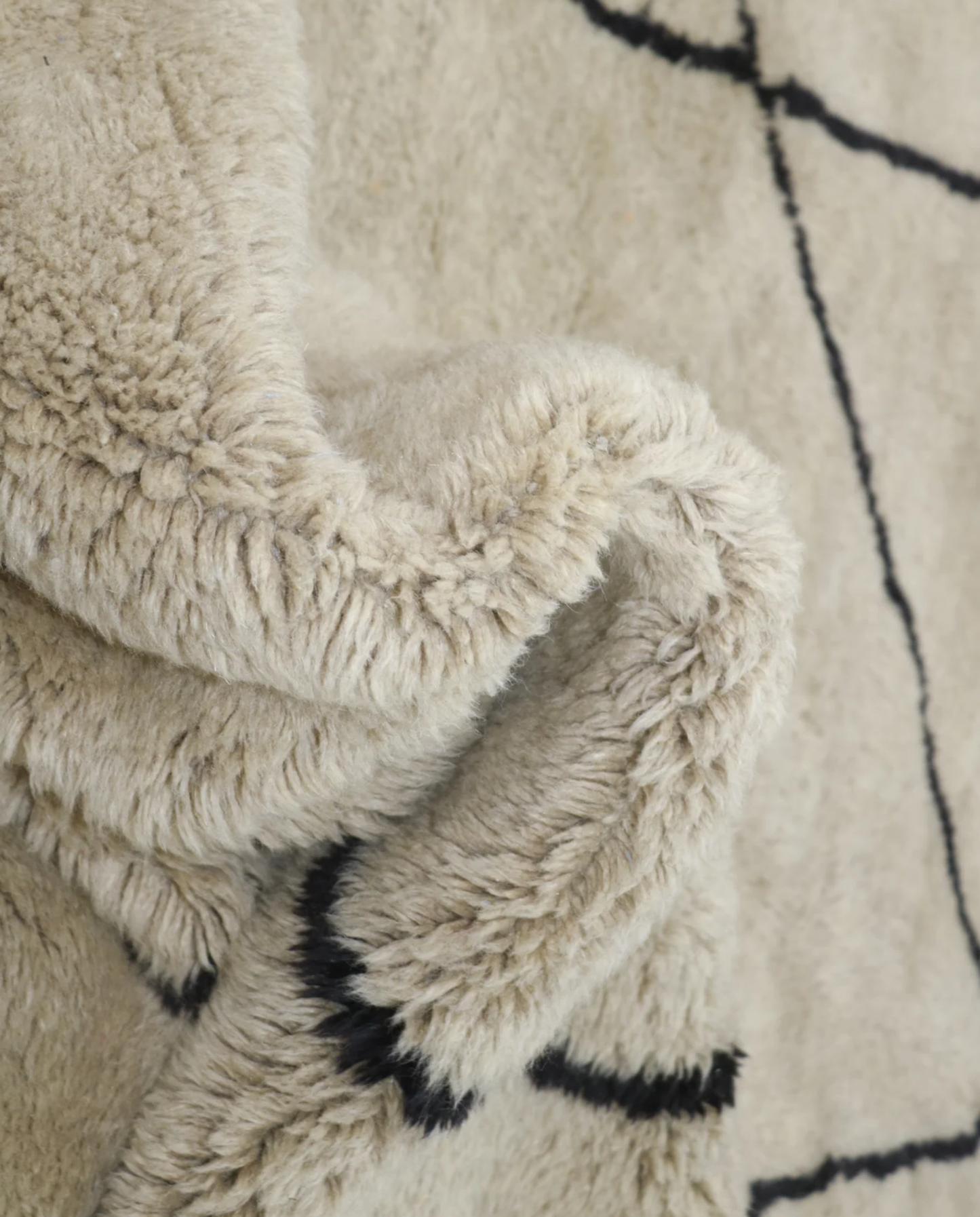 BINA Mrirt cream diamond lattice Moroccan rug close-up showing hand-knotted wool texture and pile detail, by NURA