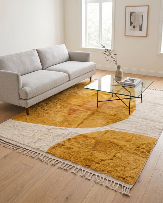 A plush mustard and cream abstract Moroccan wool rug by NURA, beautifully styled in a modern living room with warm natural light.