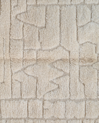 BOUTHAINA Beni Ourain cream organic abstract Moroccan rug close-up showing hand-knotted wool texture and pile detail 1, by NURA
