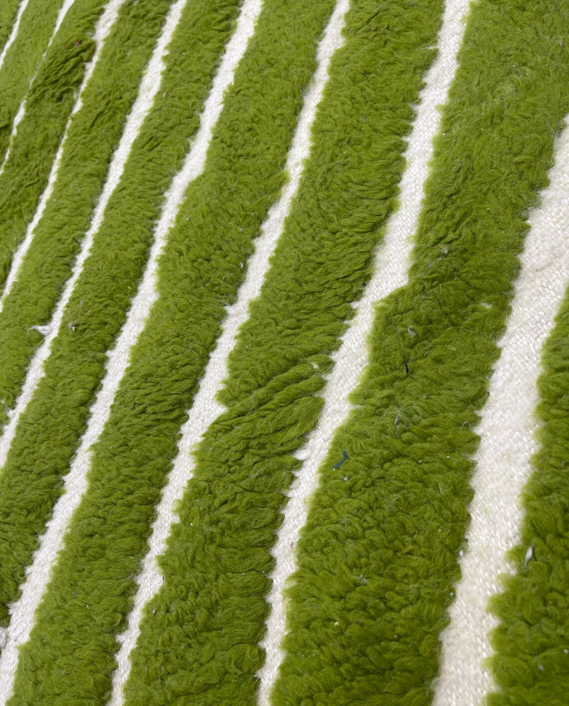 LAMIA Beni Ourain green chevron stripes Moroccan rug close-up showing hand-knotted wool texture and pile detail 2, by NURA