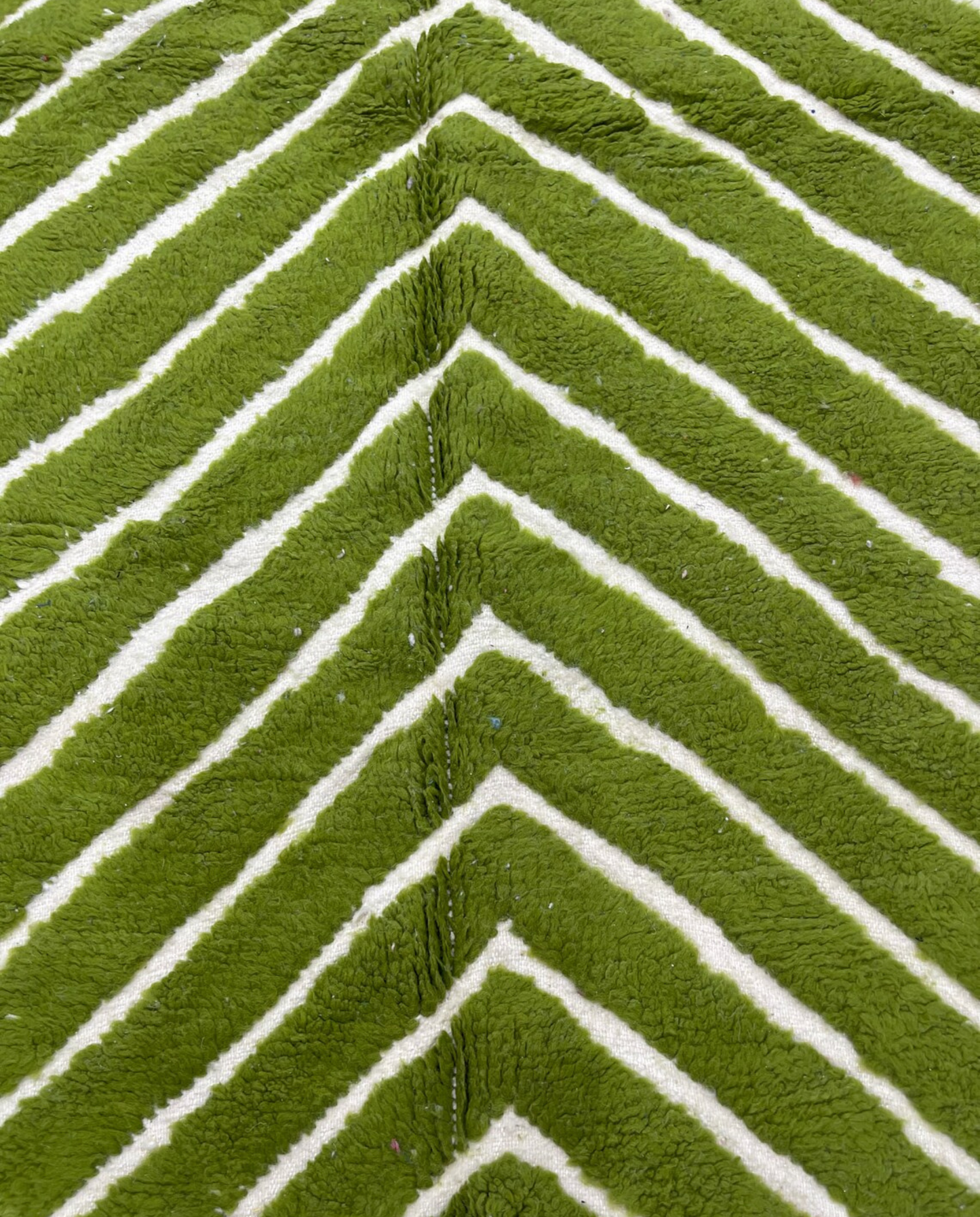LAMIA Beni Ourain green chevron stripes Moroccan rug close-up showing hand-knotted wool texture and pile detail, by NURA