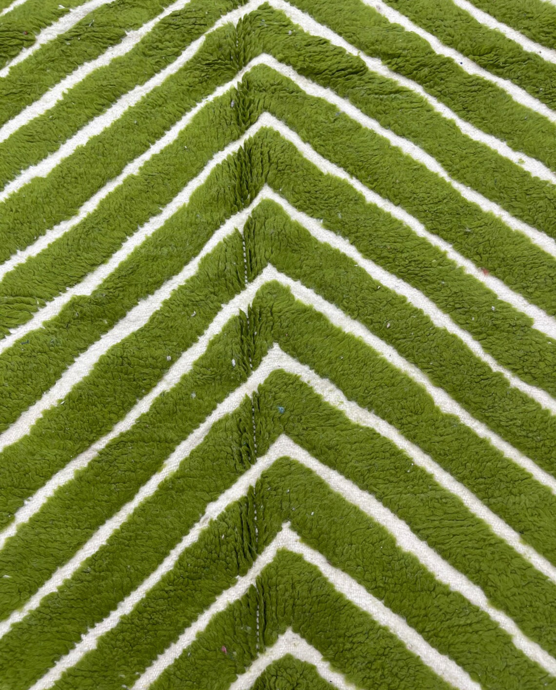 LAMIA Beni Ourain green chevron stripes Moroccan rug close-up showing hand-knotted wool texture and pile detail, by NURA