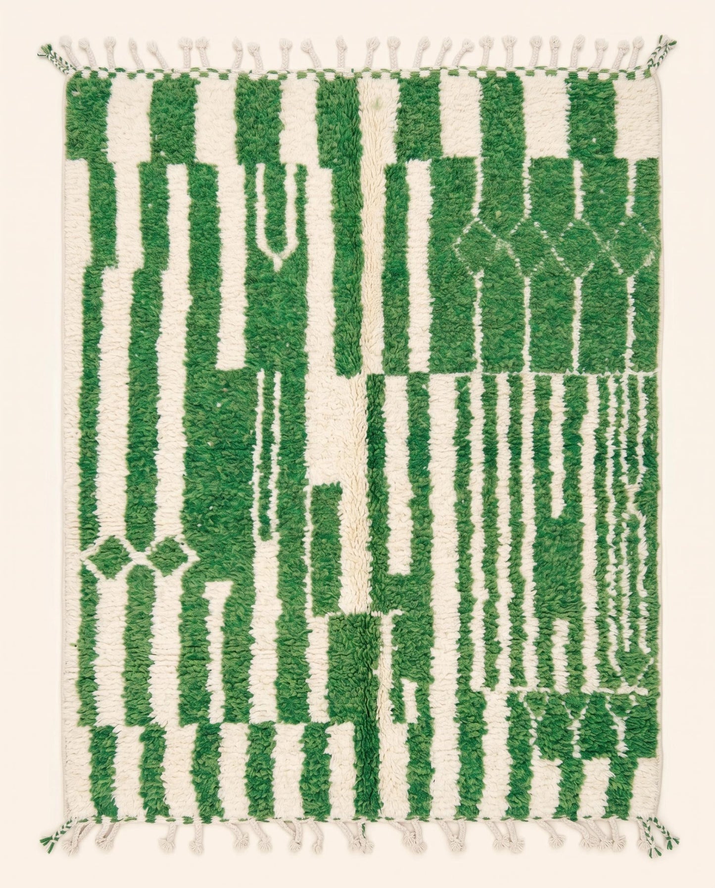 A vibrant Azilal Moroccan rug featuring a bold green and cream color block and striped pattern in plush wool, by NURA.