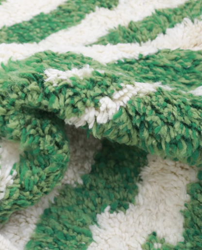 DANA Azilal green color block Moroccan rug close-up showing hand-knotted wool texture and pile detail, by NURA