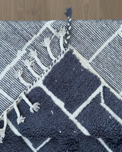 DANIA Beni Ourain charcoal irregular block grid Moroccan rug back view showing traditional handwoven construction, by NURA