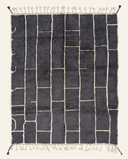 Plush charcoal Beni Ourain Moroccan rug with a bold ivory irregular block grid and a thick high pile, by NURA.