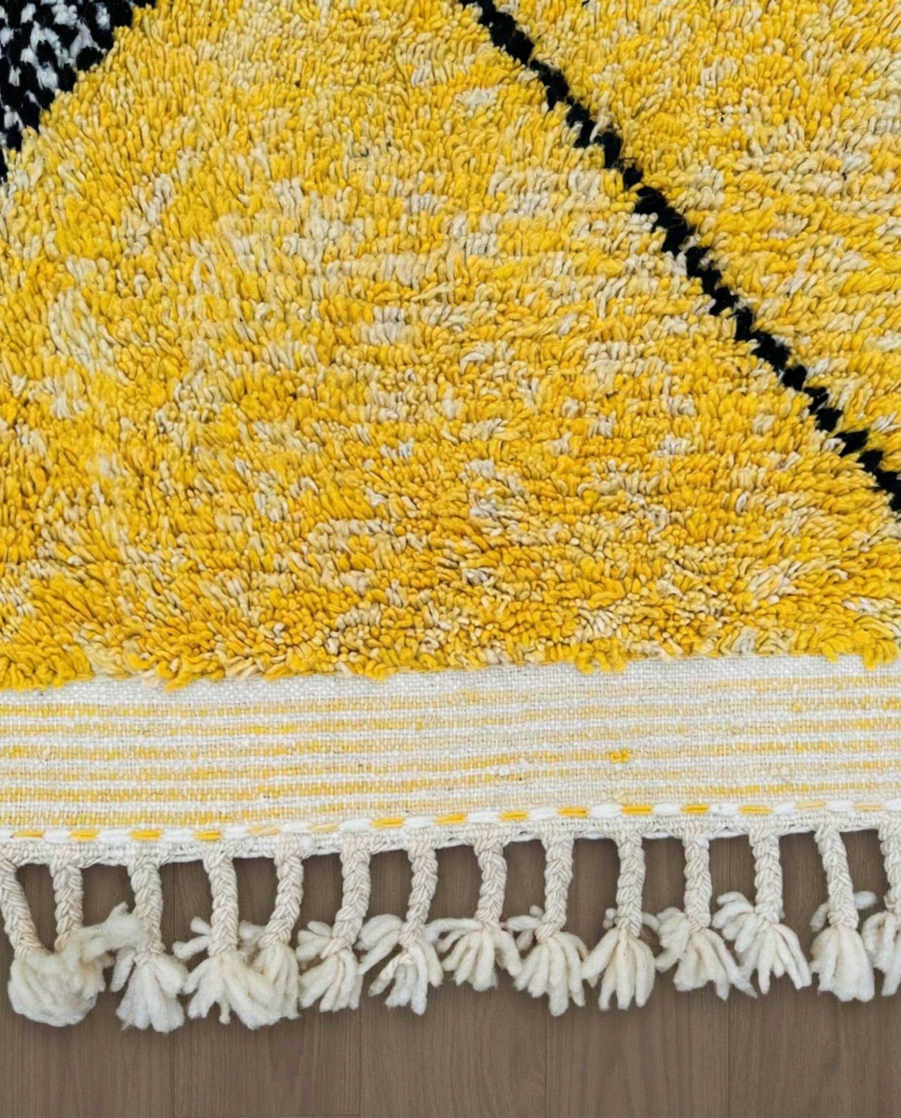 DARINE Azilal yellow abstract color block Moroccan rug close-up of hand-tied fringe and kilim band detail, by NURA