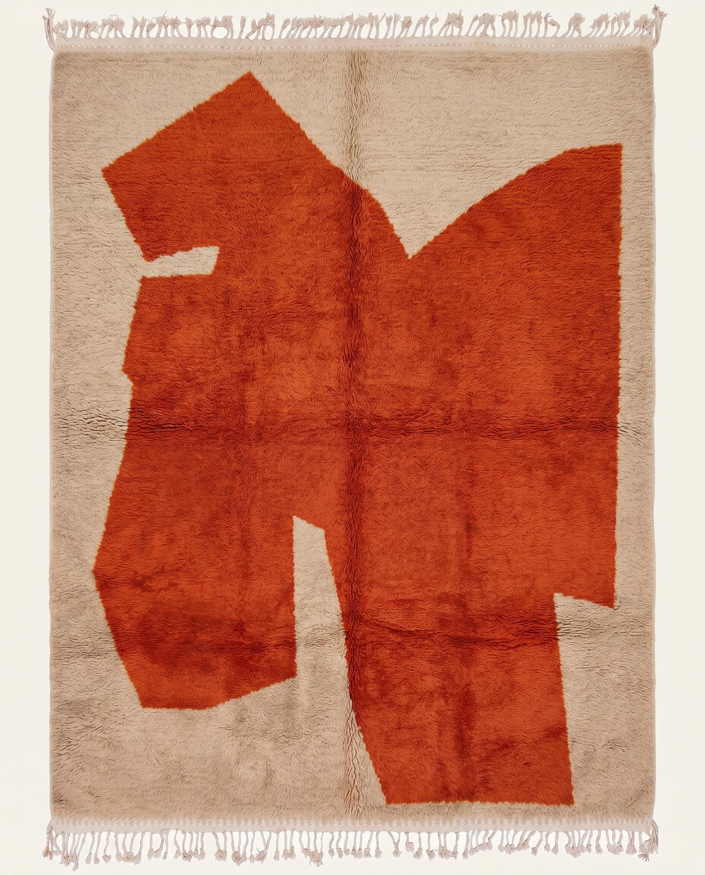 Plush cream Beni Ourain Moroccan rug featuring a massive, bold rust abstract color block and high pile, by NURA.