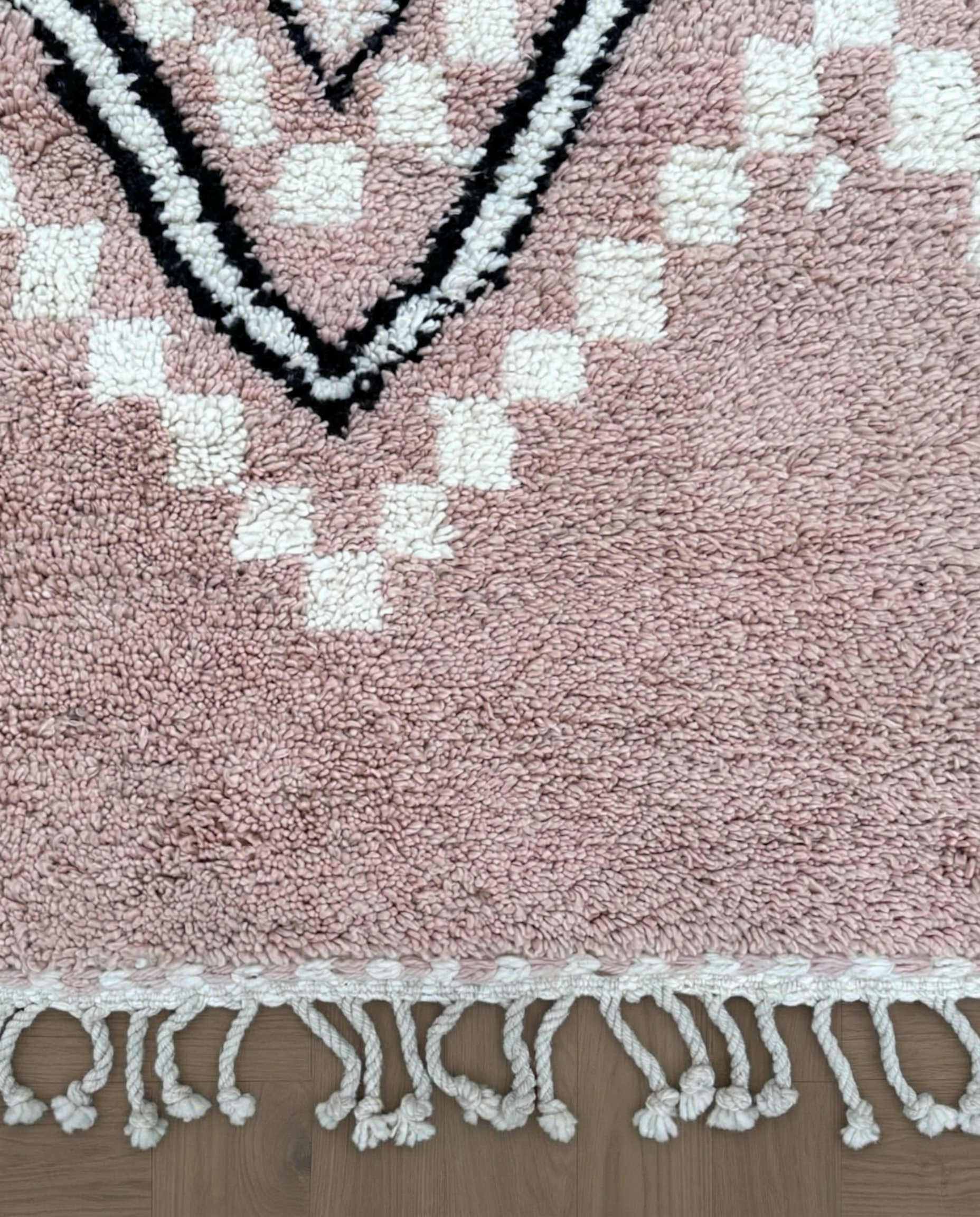 DOHA Azilal blush checker diamond lattice Moroccan rug close-up of hand-tied fringe and kilim band detail, by NURA