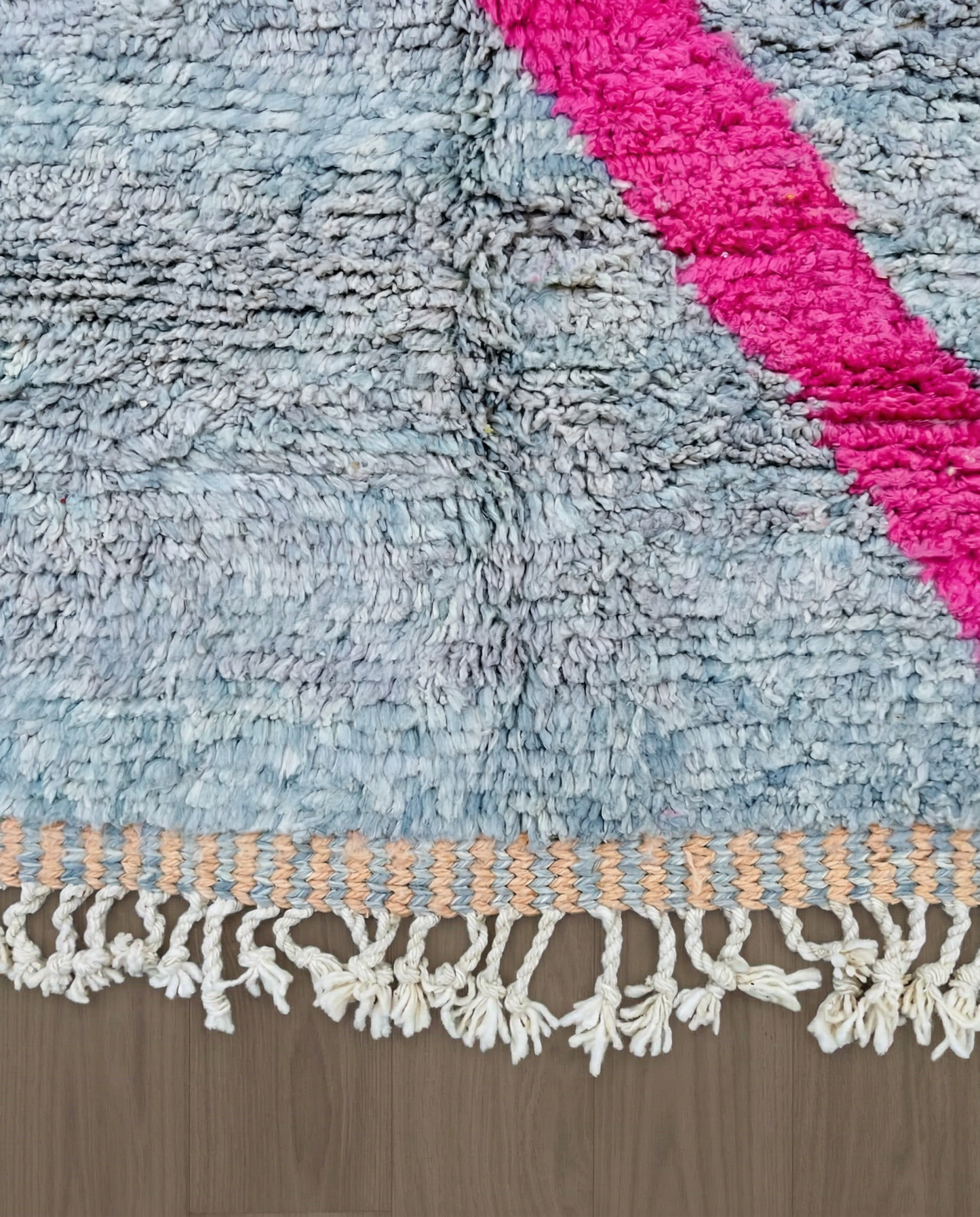 DOUNIA Azilal cream abstract color block Moroccan rug close-up of hand-tied fringe and kilim band detail, by NURA