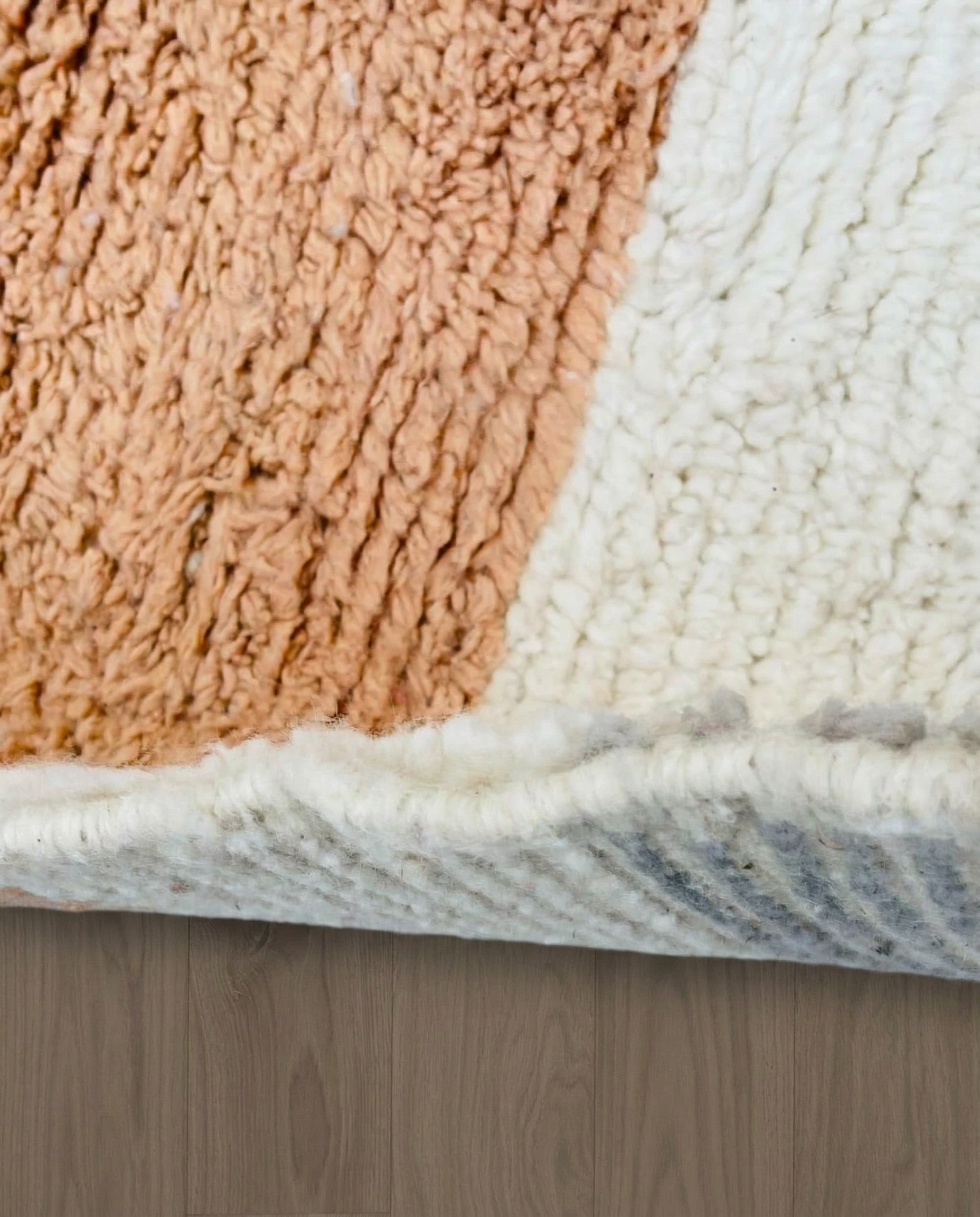 DOUNIA Azilal cream abstract color block Moroccan rug close-up showing hand-knotted wool texture and pile detail 1, by NURA