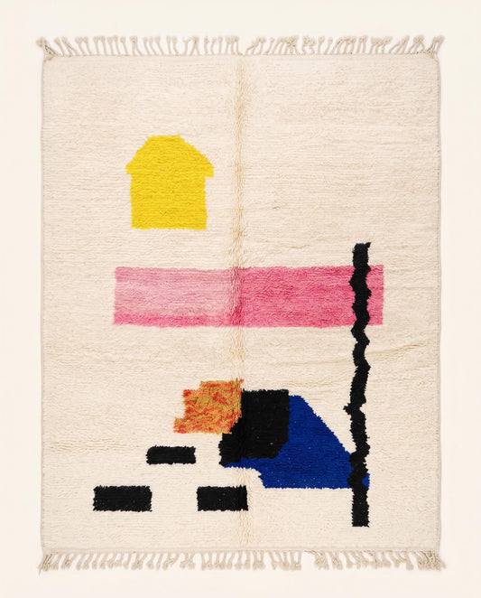 A plush cream Moroccan rug featuring playful abstract shapes in pink, blue, yellow, and black, hand-knotted by NURA.