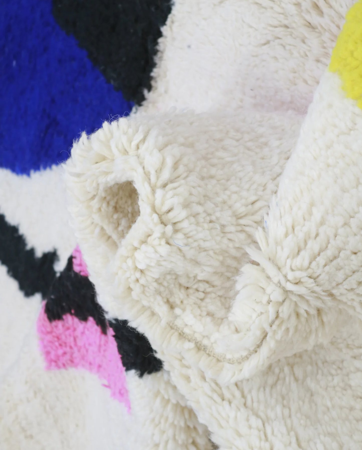 DUNA Beni Ourain cream organic abstract Moroccan rug close-up showing hand-knotted wool texture and pile detail 2, by NURA