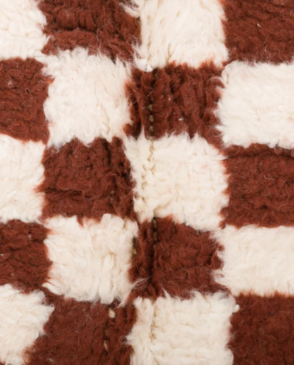 FAIZA Beni Ourain brown checker grid Moroccan rug close-up showing hand-knotted wool texture and pile detail, by NURA