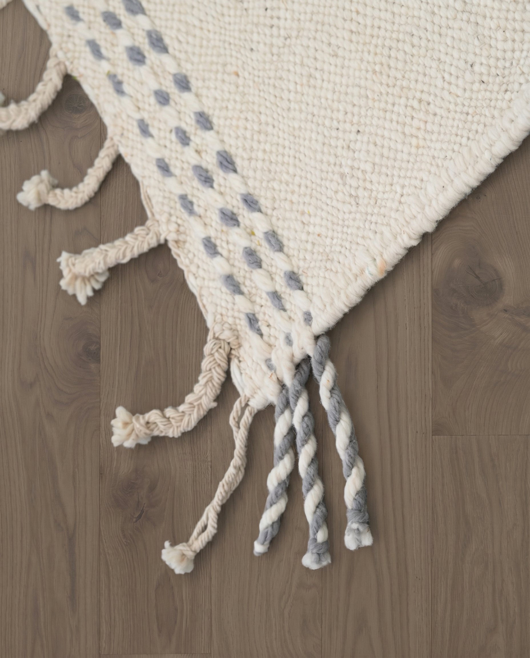 FAKKA Azilal cream color block Moroccan rug close-up of hand-tied fringe and kilim band detail, by NURA