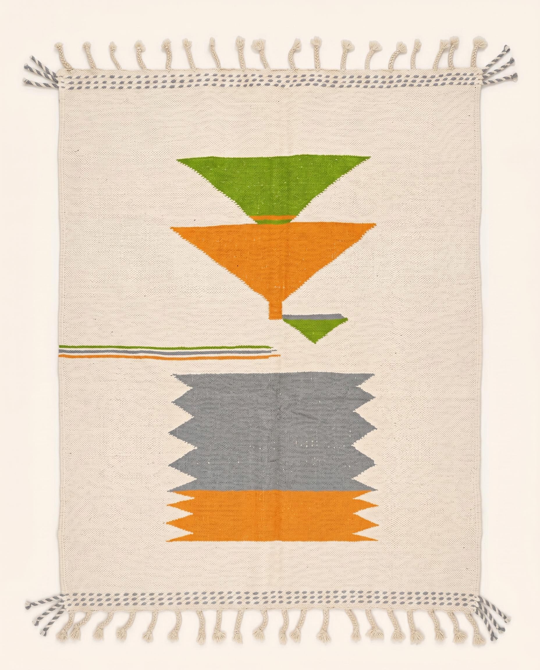 A flatwoven Moroccan kilim rug featuring bold orange, grey, and green geometric color blocks on a cream wool background by NURA.
