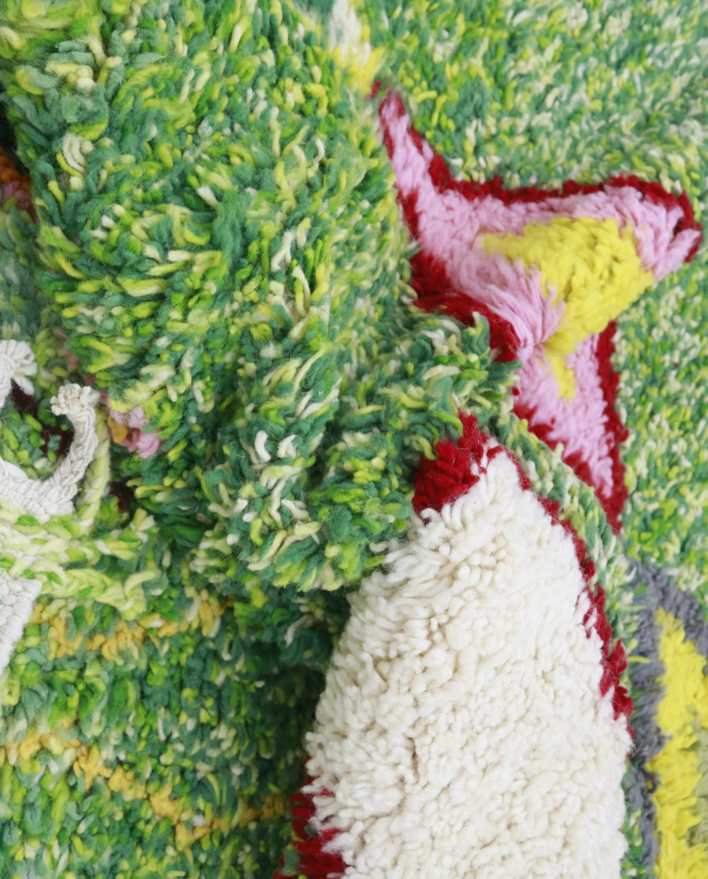 FELLA Azilal green organic abstract Moroccan rug close-up showing hand-knotted wool texture and pile detail, by NURA