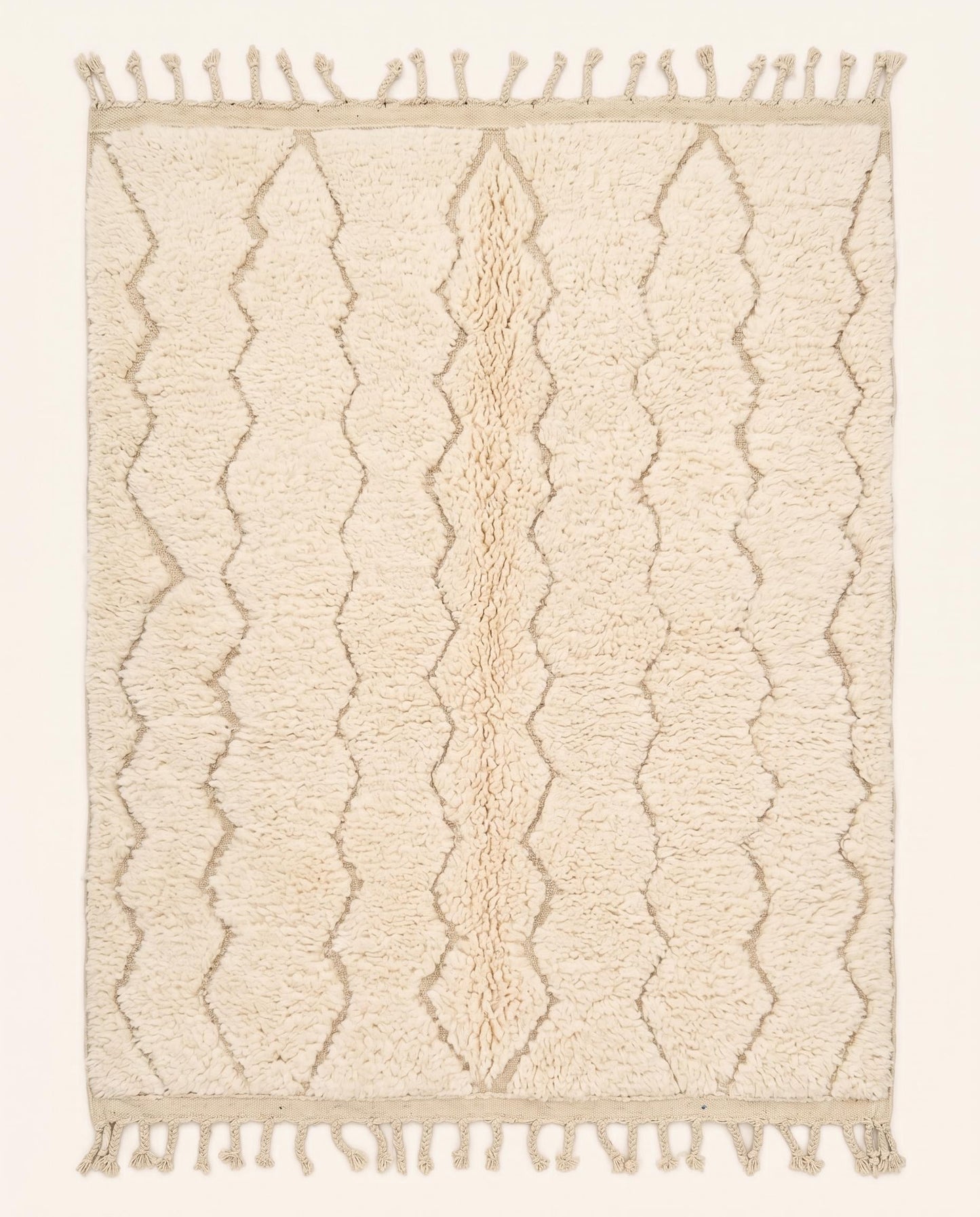 A plush cream Moroccan rug featuring a subtle carved diamond lattice pattern in natural wool, crafted by NURA.