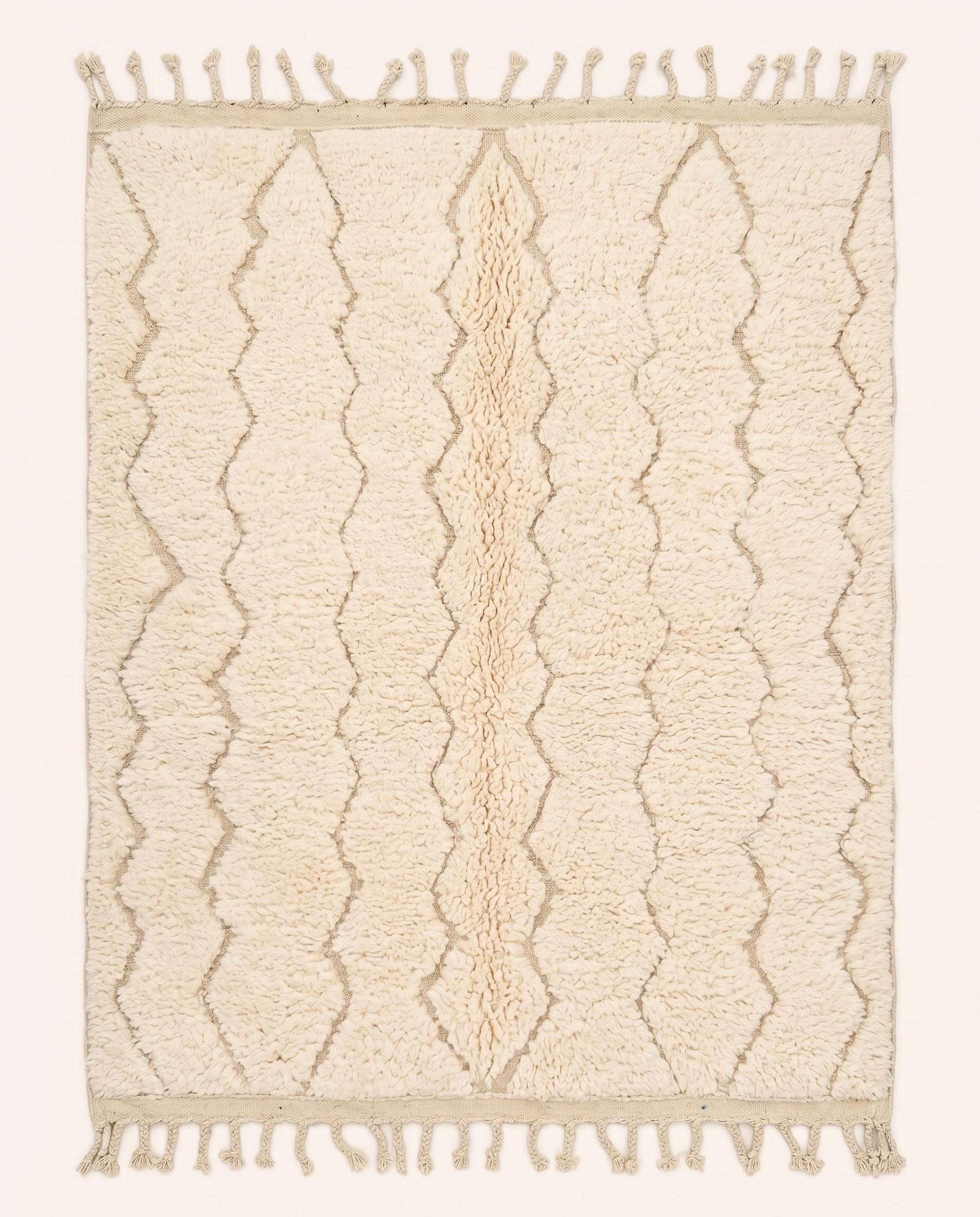 A plush cream Moroccan rug featuring a subtle carved diamond lattice pattern in natural wool, crafted by NURA.