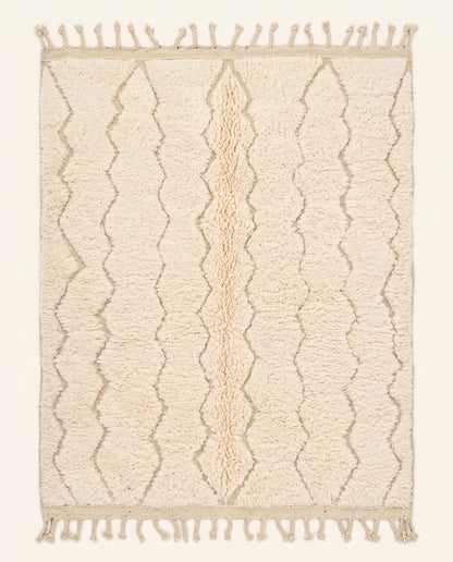 A plush cream Moroccan rug featuring a subtle carved diamond lattice pattern in natural wool, crafted by NURA.