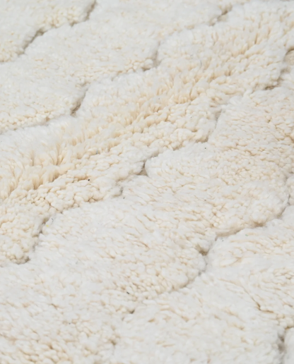 GHAZALA Beni Ourain cream diamond lattice Moroccan rug close-up showing hand-knotted wool texture and pile detail 1, by NURA