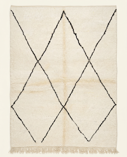 Plush ivory Beni Ourain Moroccan rug with a large-scale black diamond lattice and a thick high pile, by NURA.