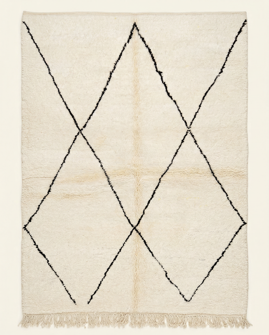 Plush ivory Beni Ourain Moroccan rug with a large-scale black diamond lattice and a thick high pile, by NURA.