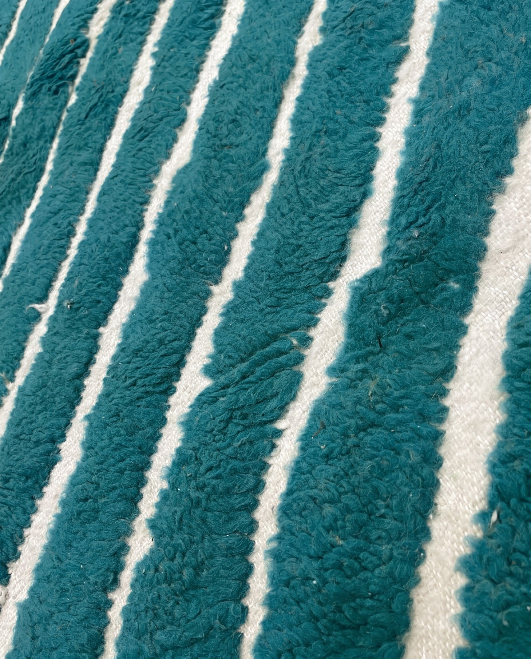 HAFIDA Beni Ourain teal chevron stripes Moroccan rug close-up showing hand-knotted wool texture and pile detail 2, by NURA