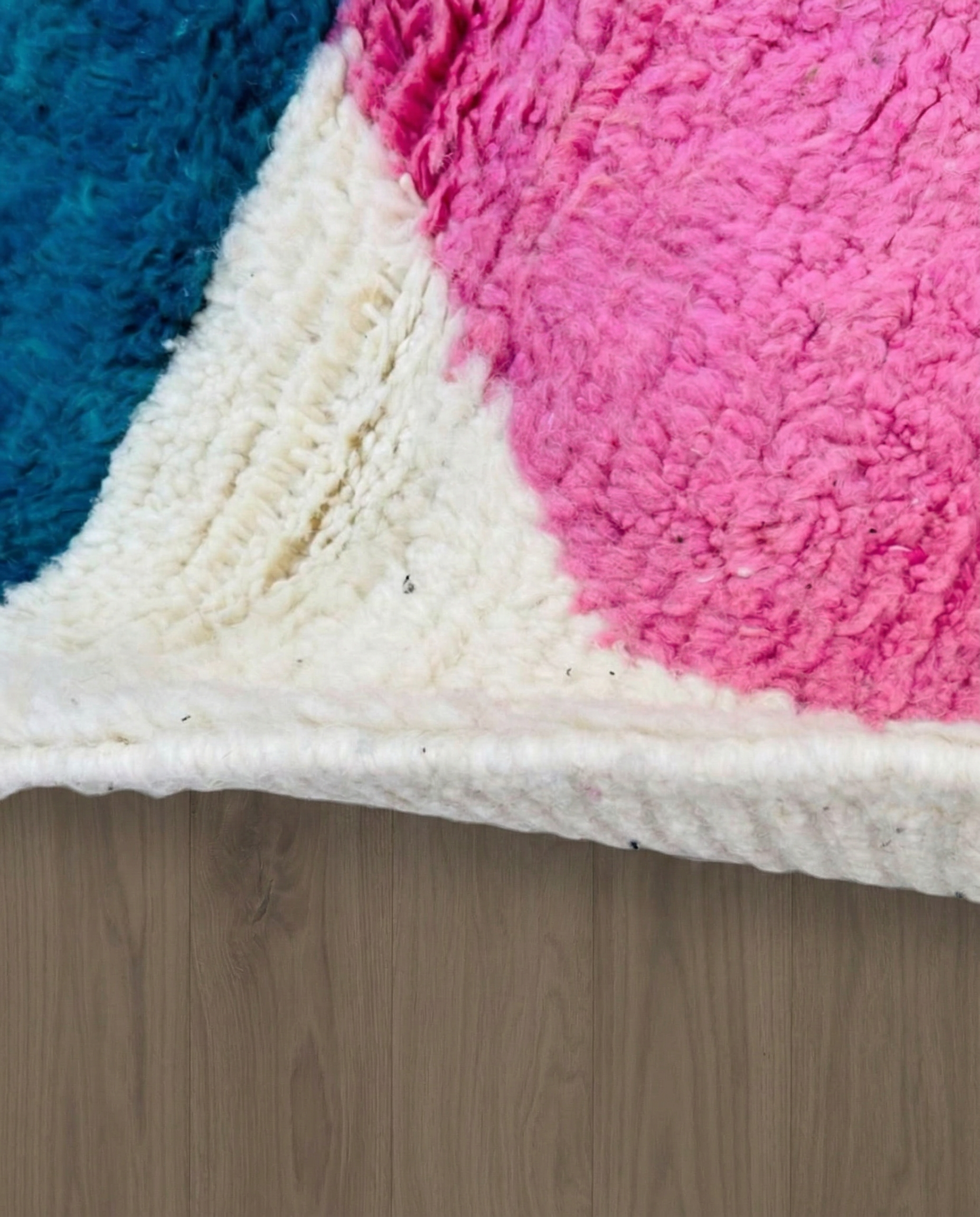 HAFSA Beni Ourain ivory abstract color block Moroccan rug close-up showing hand-knotted wool texture and pile detail 3, by NURA
