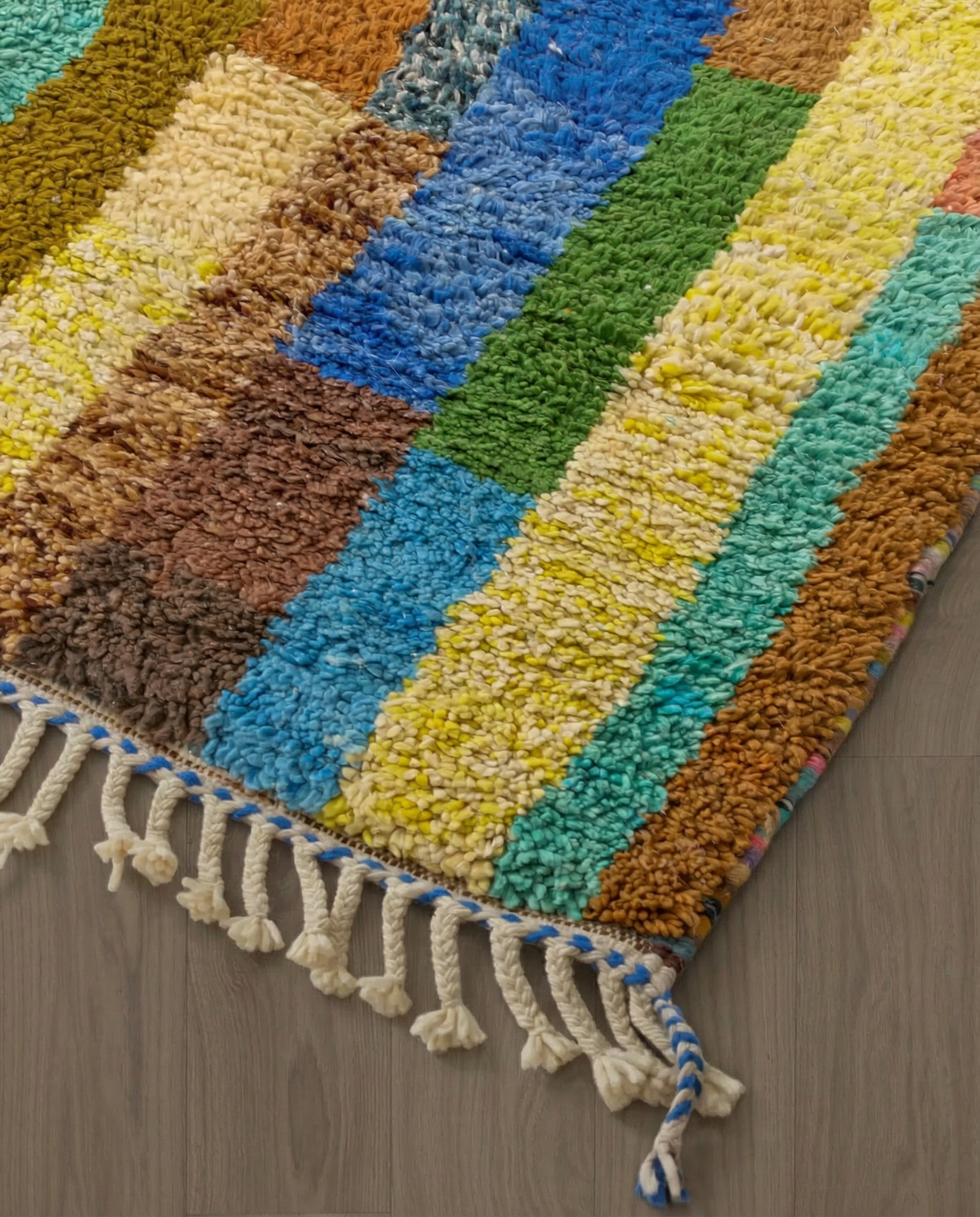 HALA Azilal olive abstract color block Moroccan rug close-up of hand-tied fringe and kilim band detail, by NURA