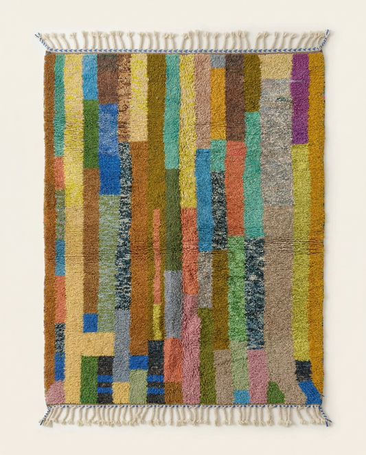 Plush multicolor Azilal Moroccan rug with a bold abstract color block pattern and braided fringe, by NURA.