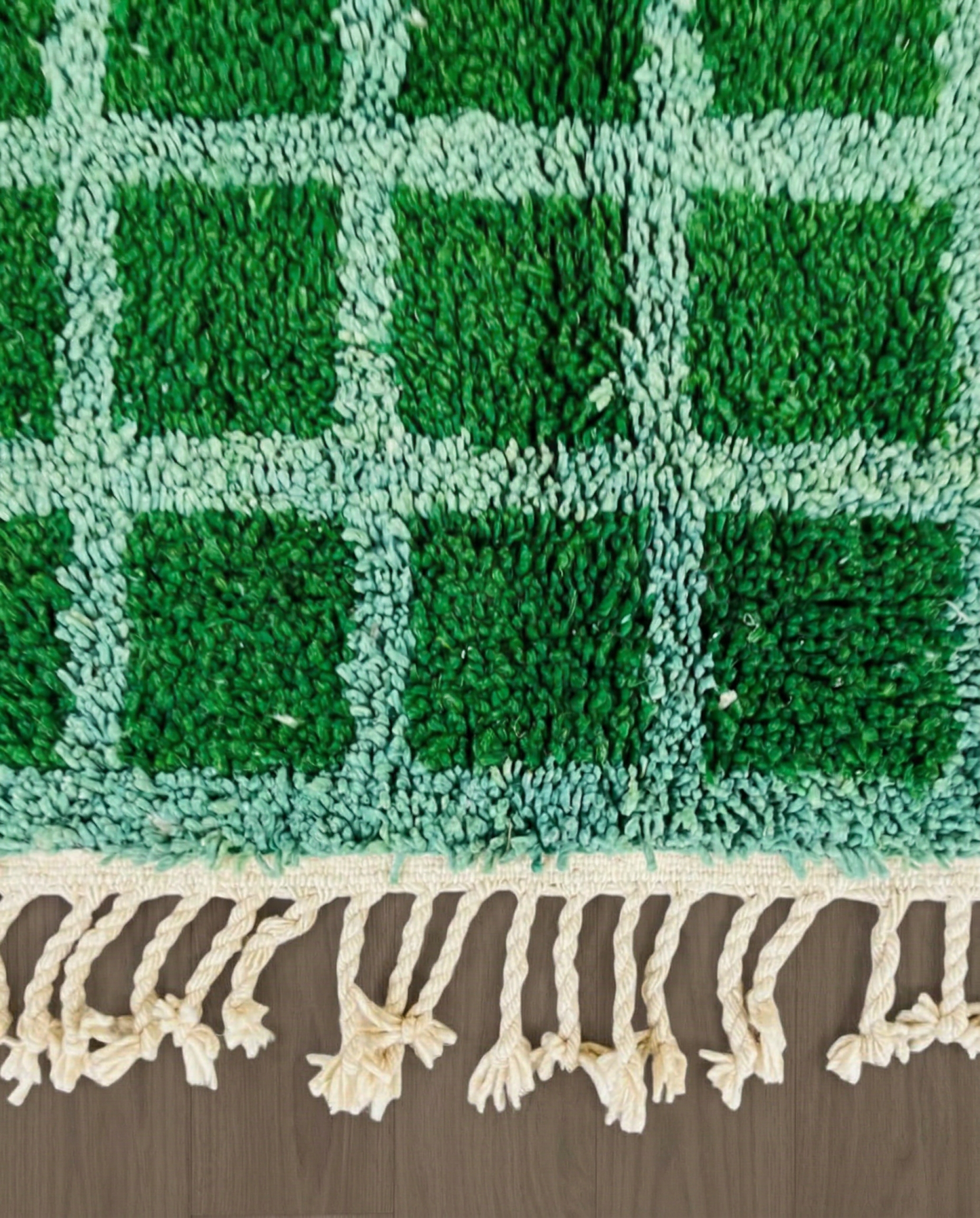 HALIMA Beni Ourain emerald checker grid Moroccan rug close-up of hand-tied fringe and kilim band detail, by NURA