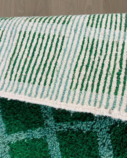 HALIMA Beni Ourain emerald checker grid Moroccan rug close-up showing hand-knotted wool texture and pile detail 3, by NURA